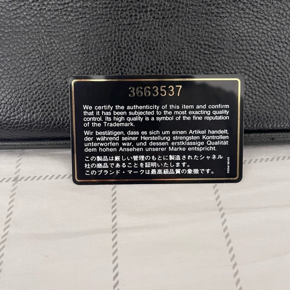 Chanel black leather bag with gold chain handle.There is a small cut on lock tag - Picture 14 of 14